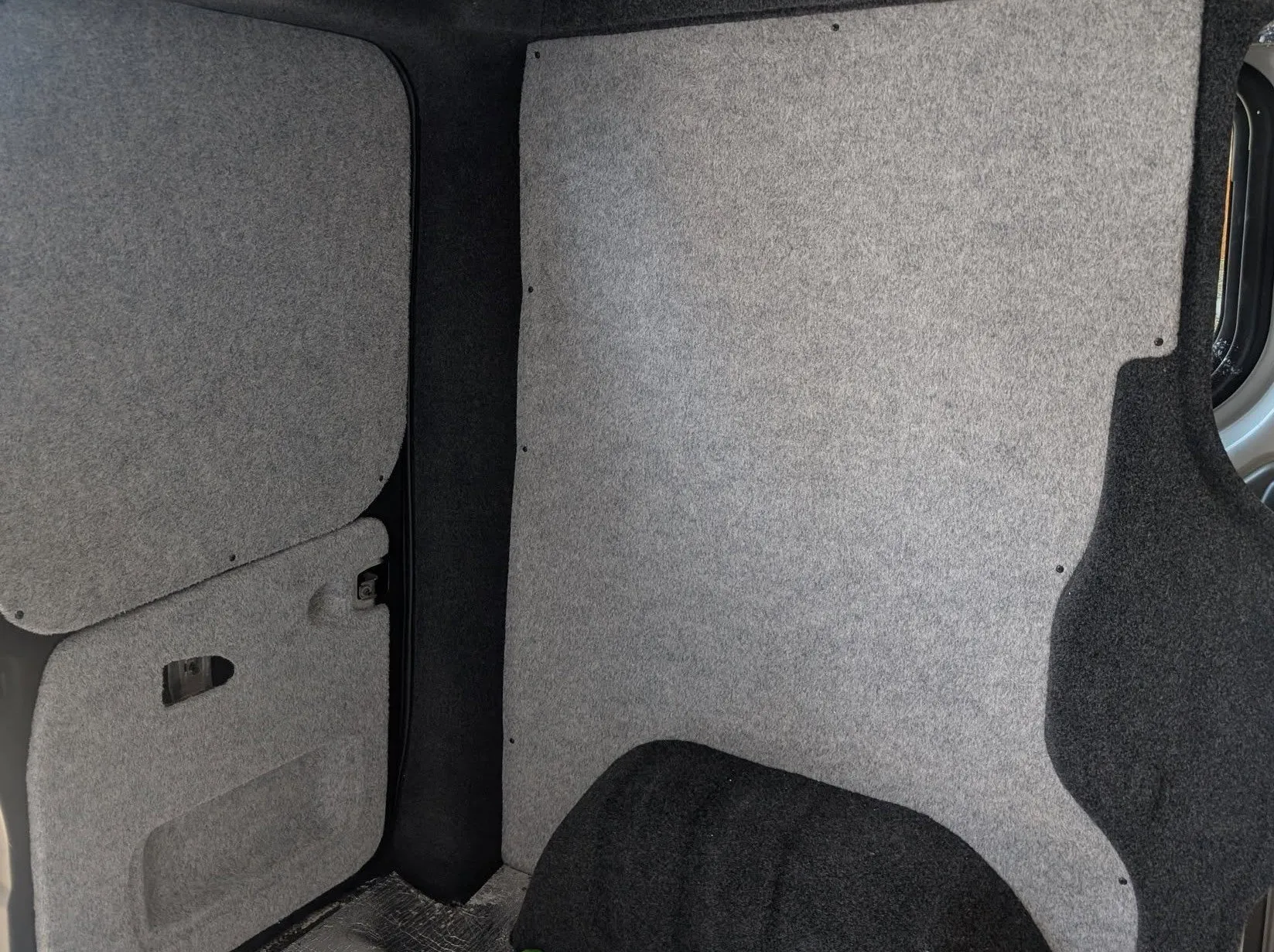 Carpet-lined campervan interior