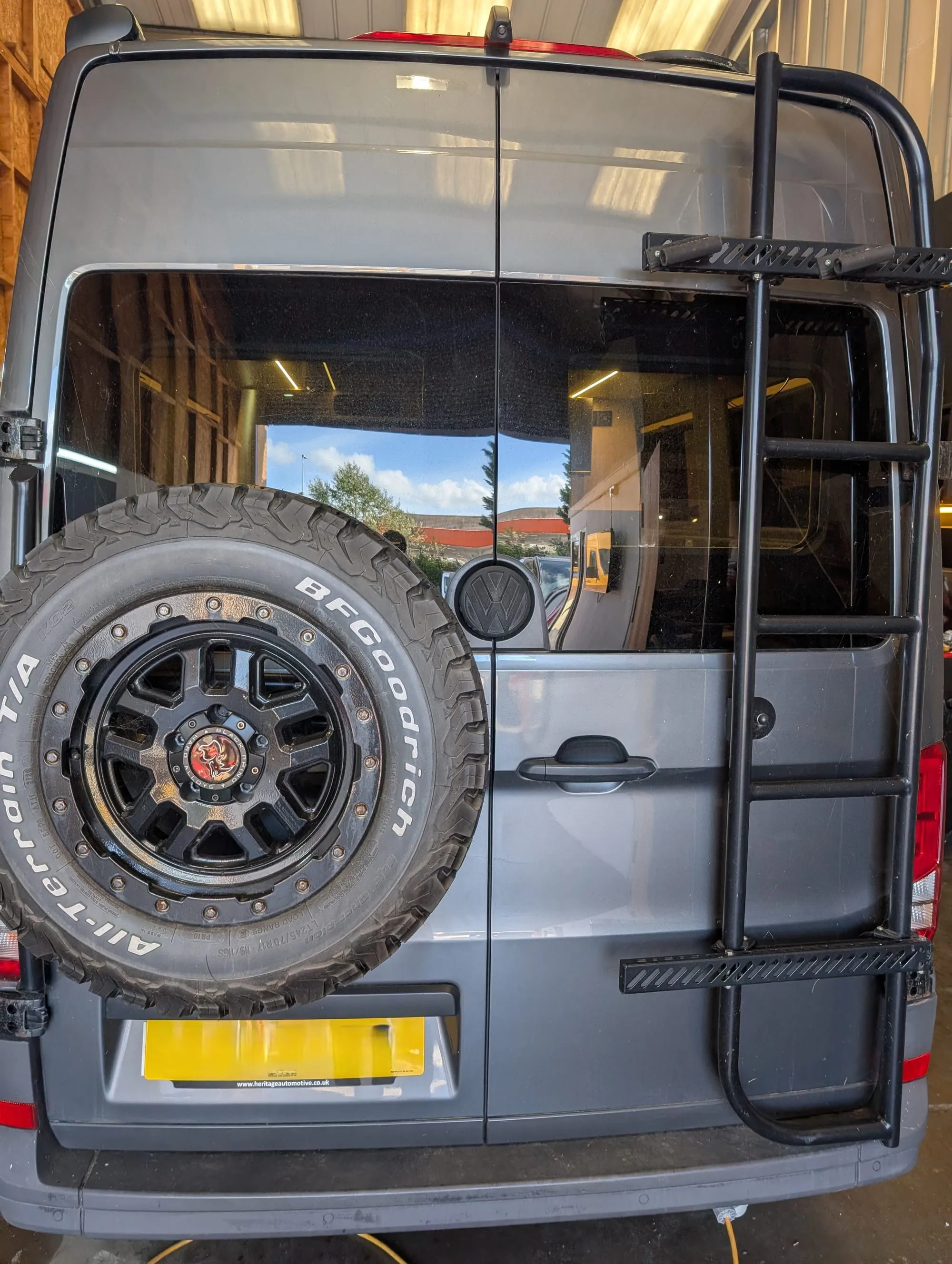 Van with rear ladder and spare wheel carrier