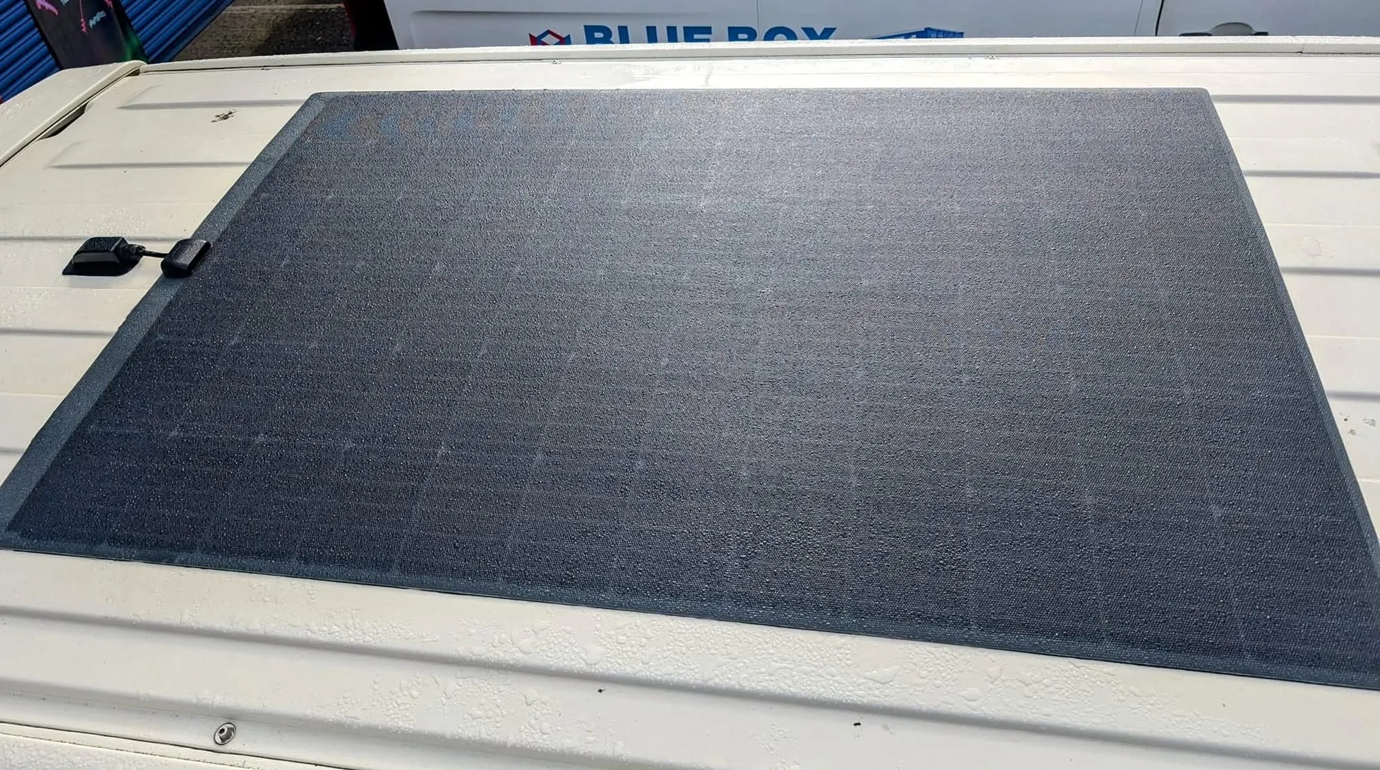 Semi-flexible solar panel fitted to a van roof